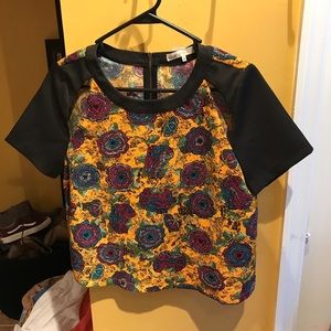 Boutique open shoulder slit top